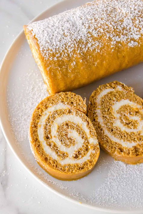 Make an easy pumpkin roll recipe using cake mix. It's a light, moist pumpkin roll swirled with cream cheese frosting that’s sure to be a fall favorite. Pumpkin Roll Easy, Pumpkin Roll Recipe Easy, Spice Cake Mix And Pumpkin, Pumpkin Roll Cake, Pumpkin Rolls Recipe, Up Pumpkin, Cake Roll Recipes, Pumpkin Pie Mix, Keto Pumpkin