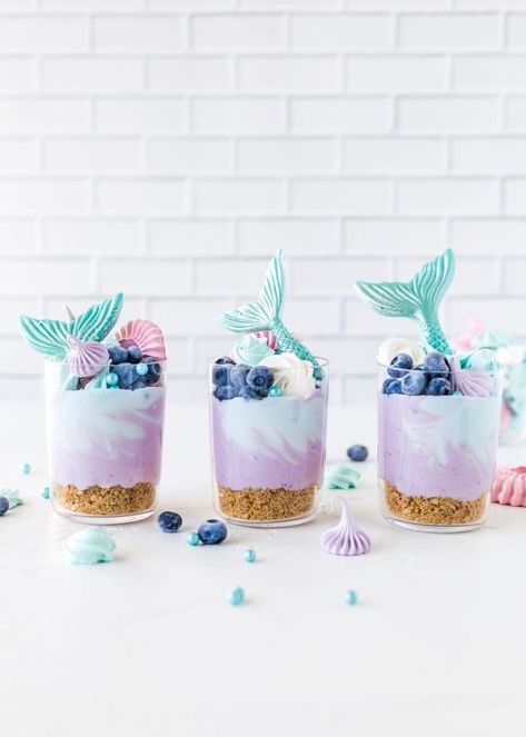 9 Fun Dessert Recipes for the Beach Lover | Mermaid Cheesecake, Cheesecake In A Glass, Sand Dollar Cookies, Mermaid Candles, Mermaid Cup, Ariel Birthday Party, Cheesecake In A Jar, Cheesecake Cups, Candle Diy