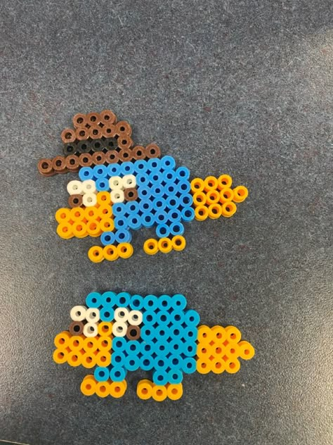 Tawog Perler Beads, Hana Beads Ideas, Perry The Platypus Perler Beads, Perry The Platypus Pixel Art, Yellow Perler Bead Patterns, Cartoon Perler Bead Patterns, Smiling Friends Perler Bead, Cute Fuse Beads Ideas, Blue Perler Bead Patterns