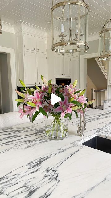 B&C on Instagram: "The Right Vase for the Right Flower 🌸!! A graceful arrangement incorporates balance, proportion, and scale. Save these tips for your tall arrangement: • Tall arrangement requires flowers with thick stems, like Lilies and Hydrangeas; • The rule of thumb is that the flowers you put in a vase should be 2.5 times the height of the vase. The vase on the video is 10 inches tall, so your flowers should stand 25 inches tall. But being off by an inch or two for long-stem flowers won’t make much of a visible difference. • Cut the first stem, and once you are happy with the length, cut all the stems at the same height. • Letting leaves rot in water is one of the best ways to bring your flowers down. Get rid of foliage below the water line, and snip off any leaves that are broken o How To Arrange Flowers In A Vase, Lilies Arrangement, Stem Flowers, Large Glass Vase, Long Stem Flowers, Bring Them Home, Rule Of Thumb, In Water, Place Settings