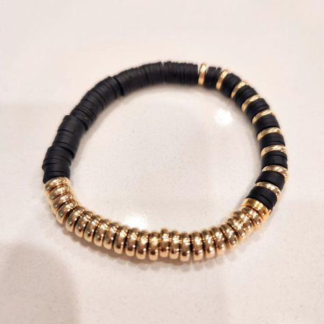 ✨ Strengthen your friendship with the *Midnight Bond Bracelet*! ✨ This beautiful friendship bracelet combines gold beads with black disk clay beads, symbolizing the timeless bond you share. 💛🖤 Now available on our Etsy and TikTok shop! Choose from a variety of colors: white, red, green, pink, brown, and tan. Don't miss out—order yours today! 🌟 #elegant #homemade #new #fashion #fashionstyle #beautiful #gold #goldjewellery #instagram #instagood #like #love #foryoupage #friendshipbracelets #fr... Black Heishi Beads Jewelry For Friendship, Brown Clay Bead Bracelet, Black And Gold Clay Bead Bracelet, Black Clay Bracelet, Black Gold-plated Bracelets, Bond Bracelet, Clay Beads, Gold Beads, Friendship Bracelets