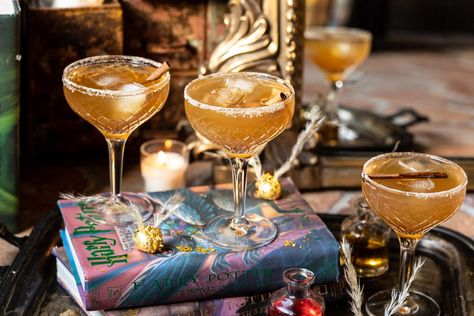 The Golden Snitch Cocktail | halfbakedharvest.com #harrypotter #cocktails #easy #fall Company Decor, Harry Potter Cocktails, Winter Beverages, Cocktails Easy, The Golden Snitch, Whisky Cocktail, Fall Cocktail, Drink Inspiration, Sweet Cocktails