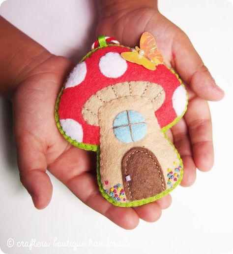 This handmade felt decoration looks a lot like the mushroom houses in Smurf Village! | free felt craft pattern from Crafters Boutique Handmade Spring Sewing Projects, Easy Felt Crafts, Mushroom Cottage, Felt Craft Projects, Spring Sewing, Felt Mushroom, Felt Ornaments Patterns, Mushroom Crafts, Baby Mobil