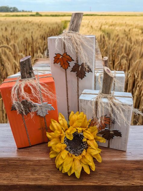 Add charm to your home decor with these rustic blocky pumpkins. Make from wood and hand painted these are the perfect way to elevate your fall decor. Diy Fall Decorations Dollar Store, Thanksgiving Wood Crafts, Block Pumpkins, Fall Board, Fall Crafting, Tea Crafts, Wood Centerpieces, Booth Displays, Thanksgiving Decorations Diy