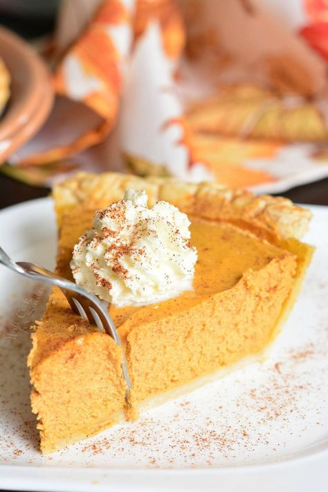 pumpkin cheesecake pie on a plate with whip cream on top with a fork taking a piece off Pumpkin Cheesecake Pie, Short Pastry, Classic Pumpkin Pie, Will Cook For Smiles, Baker By Nature, Buckwheat Cake, Pumpkin Pie Cheesecake, Cheap Clean Eating, Cheesecake Pie