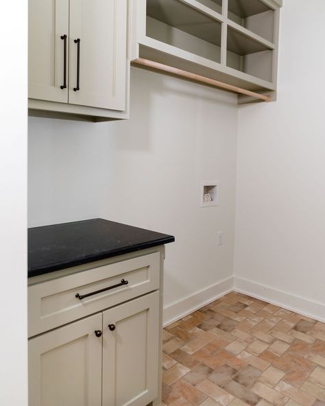 This laundry room + mudroom combo🤌🏻 Laundry design, mudroom design, #laundryinspo, laundry sink, Arkansas interior designer, interior design, mudroom cabinets, laundry sink, gold faucet, black countertops, honed granite, #laundryroom #mudroom, European inspired, transitional design, #organicmodern Laundry Room Mudroom Combo, Euro Laundry, Granite Countertop Ideas, European Laundry, Laundry Room/mudroom, Mudroom Cabinets, Honed Granite, Gold Faucet, Black Countertops