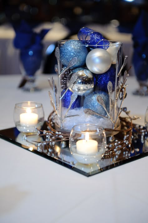 Corporate Holiday Party Ideas Christmas Centerpieces, Blue And White Holiday Centerpieces, 60th Winter Birthday Party Ideas, Blue And Silver Christmas Centerpieces For Table, Blue Winter Wedding Centerpieces, Snowflake Wedding Centerpieces, Blue Christmas Centerpieces For Table, Blue Christmas Centerpieces, Christmas Party Centerpieces Corporate