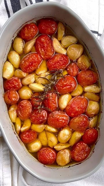 Fetty's Food Blog on Instagram: "Garlic & Tomato Confit 🧄🍅 Silky, smooth, olive oily goodness. If you love sourdough, you MUST try this on sourdough toast. Ingredients: 1 cup grape tomatoes, rinsed 3/4 cup garlic cloves 1/3 cup olive oil 1 sprig rosemary Salt to taste Toast to serve Instructions: Preheat oven to 350 F. Add tomatoes and garlic into a small/medium baking dish into a single layer. Drizzle olive oil over the top, place rosemary on top, and season with salt. Bake for 40-45 minute Tomato And Olive Oil, Roasted Garlic Cloves And Tomatoes, Tomato And Garlic Confit, Tomato Garlic Confit, Roast Garlic Bulb, Tomato Chips, Roasted Tomatoes And Garlic, Grape Tomato Recipes, Roasted Grape Tomatoes