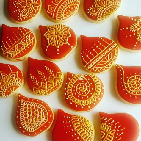 Cookies done for a Mehendi Ceremony ! #mehendicookies #redandgoldcookies #tasteofindia #lacecookies #mehendiartists #royalicingcookies… Indian Wedding Cookies Decorated, Bollywood Style Gold Embroidered Wedding Fabric, Mehendi Cookies, Desi Red Aesthetic, Desi Engagement, Luxury Red Bollywood Embroidered Fabric, Mehendi Ceremony, Lace Cookies, Desi Wedding Decor