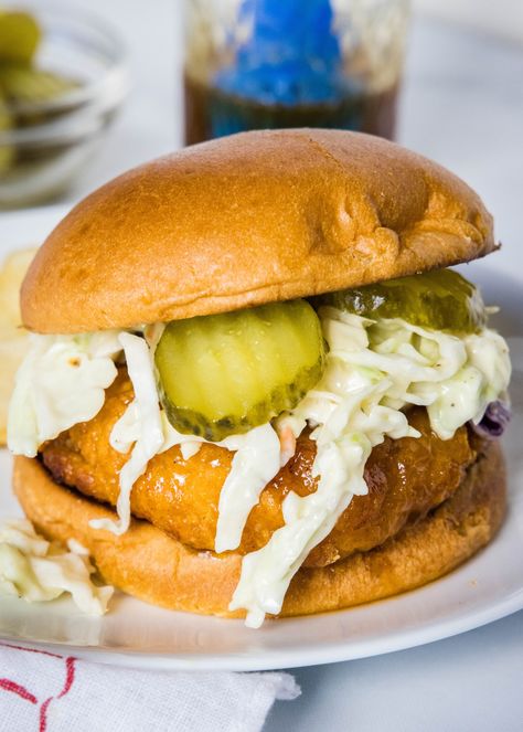 Make a hot honey chicken sandwich with crispy chicken coated in spicy honey, served between fluffy burger buns with cool and crunchy coleslaw! Nashville Hot Chicken Sandwich Recipe, Hot Honey Chicken Sandwich, Honey Chicken Sandwich, Crunchy Coleslaw, Hot Honey Chicken, Boneless Chicken Wings, Crispy Chicken Burgers, Hot Chicken Sandwiches, Chicken Filet