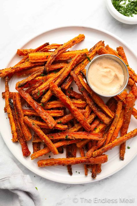 Have you ever tried carrot fries? If not, you need to! They're an easy-to-make, delicious, and healthy side dish. Seasoned to perfection, the sweetness of the carrot amplifies as the natural sugars caramelize, and the outside becomes crispy and delicious while the inside stays soft. Carrot fries are a healthy recipe that feels like a treat! #theendlessmeal #carrots #carrot #carrotfries #fries #sidedish Cinnamon Carrot Fries, Carrot French Fries, Crispy Carrot Fries, Carrot Fries Recipe, Carrot Fries Baked, Cinnamon Carrots, Yam Fries, Butternut Squash Fries, Spicy Carrots