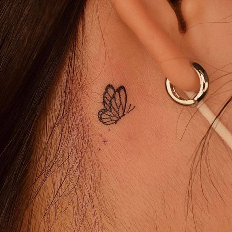 minimalistic butterfly tattoo located behind the ear. Back Of Ear Butterfly Tattoo, Mini Butterfly Tattoo Behind Ear, Half Butterfly Tattoo Behind Ear, Butterfly Hearts Tattoo, Minimalist Tattoos Behind Ear, Matching Tattoos For Best Friends Behind Ear, Tiny Butterfly Tattoo Behind Ear, Semi-colon Butterfly Tattoo Behind The Ear, Monarch Butterfly Tattoo Behind Ear