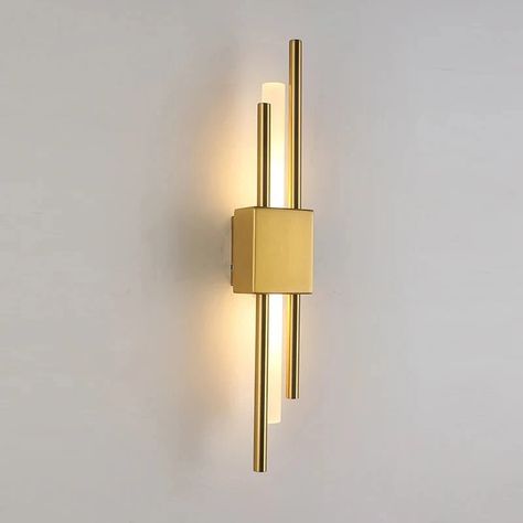 The Sparone Wall Sconce features a striking design with sleek metallic bars in a gold finish, providing an elegant yet contemporary look.💡 Its integrated LED lighting offers energy-efficient illumination, perfect for accentuating hallways, living rooms, or bedrooms with a touch of modern sophistication. #interiordesign #interiordesignideas #lampsdesign #homedecor #homedecorideas Fireplace Sconces, Future House Living Room, Hallway Wall Sconces, European Lighting, Contemporary Wall Lights, Sconces Living Room, Bedside Wall Lights, Metal Wall Lamp, Led Wand