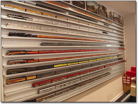 Love this wall mounted display method for a miniature train collection. Shelves For Collectibles, Wall Mounted Display Case, Model Train Display, Toy Trains Storage, Train Display, Miniature Train, Train Collection, Model Train Table, Model Train Accessories