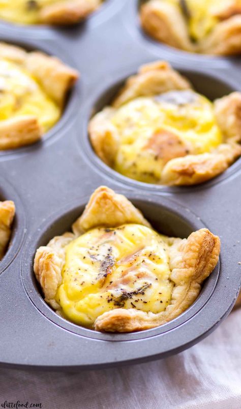 Cheddar and Ham Quiche Cups are made with a puff pastry crust, making these a great quick-and-easy breakfast recipe! Plus, this cheddar and ham quiche recipe can be made ahead of time, stored in the freezer, and baked up whenever you need an on-the-go breakfast! Breakfast Quiche Sausage, Breakfast Puff Pastry, Ham Quiche Recipe, Puff Pastry Breakfast, Recipes Using Puff Pastry, Breakfast Pastry Recipes, Pastry Breakfast, Quiche Cups, Ham Quiche