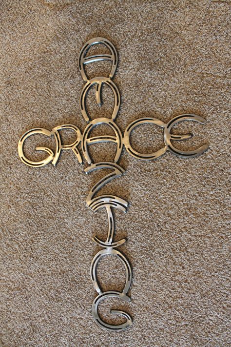 Horseshoe Amazing Grace cross made of new horseshoes fully welded and powder coated to last a lifetime. This cross would be the perfect addition to any wall or home decor. Give this beautiful cross to the special person in your life. This cross is 34 inches long and 22 inches wide. All pieces now come powder coated. Rebar Welding Projects, Easy Welding Projects, Horseshoe Cross, Amazing Grace Cross, Adult Baptism, Horseshoe Crafts Projects, Cool Welding Projects, Hymn Art, Metal Welding Art