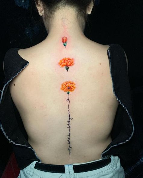 Marigold with words spine tattoo Marigold Back Tattoo, Words Spine Tattoo, Marigold Tattoos, Watercolor Marigold, Tattoo Designs With Meaning, Marigold Tattoo, Designs With Meaning, Meaning Art, Clavicle Tattoo