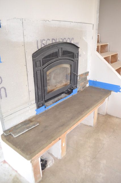 DIY Fireplace with stacked stone and concrete2 How To Build A Raised Fireplace Hearth, Raised Fireplace Hearth Ideas, Diy Hearth For Fireplace, Diy Fireplace Hearth, Raised Fireplace Hearth, Raised Fireplace, Fake Fireplaces, Fireplace Hearth Stone, Sunroom Fireplace