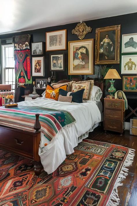 An eclectic art collection adds personality to your boho bedroom, channeling the creative spirit of the 1980s. Tap to see how to curate your own gallery wall! Cozy Eccentric Bedroom, Folk Bedroom Aesthetic, Eclectic Interior Bedroom, Eclectic Maximalism Bedroom, Vintage Eclectic Bedroom, Moody Eclectic Bedroom, Eclectic Vintage Bedroom, Cozy Eclectic Bedroom, Noir Decor