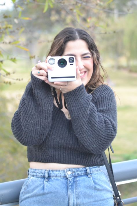 Girl taking a Polaroid picture Taking Polaroid Pictures, Picture Polaroid, Polaroid Picture, Portrait Pictures, Polaroid Pictures, 2025 Vision, Senior Pics, Picture Poses, Senior Pictures