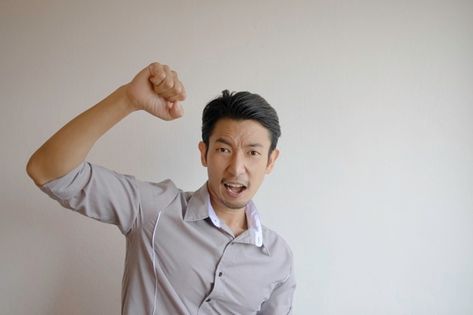 Asian men wearing gray shirts raising fi... | Premium Photo #Freepik #photo #man #student #celebration #work Ok Hand Sign, Celebrating Success, How To Pass Exams, Pointing Hand, Smiling Man, Blonde Model, Gothic Girls, Grey Shirt, Asian Men