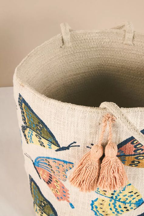 Butterfly Basket | Anthropologie Pottery Barn Animal Basket, Cute Boho Basket, Kids Room Storage Baskets, Cute Boho Baskets, Anthropologie Fruit Basket, Book Basket Playroom, Baskets For Baby Room, Basket Of Books Nursery, Baby Book Storage Basket