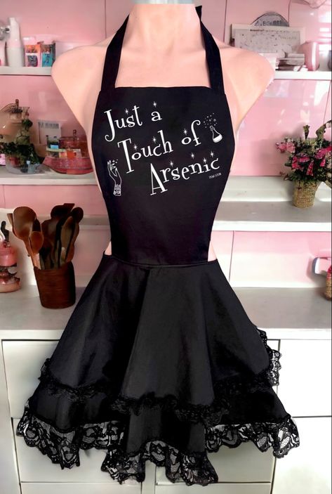 Vintage inspired ruffled black apron with cute white graphic that says “just a touch of arsenic”  has a pinup gothic vibe. One size. Gothic Apron, Anime Fireworks, Housewife Apron, Gothic Pinup, Pinup Apron, Ruffled Apron, 50s Housewife, Branded Aprons, Ruffle Apron