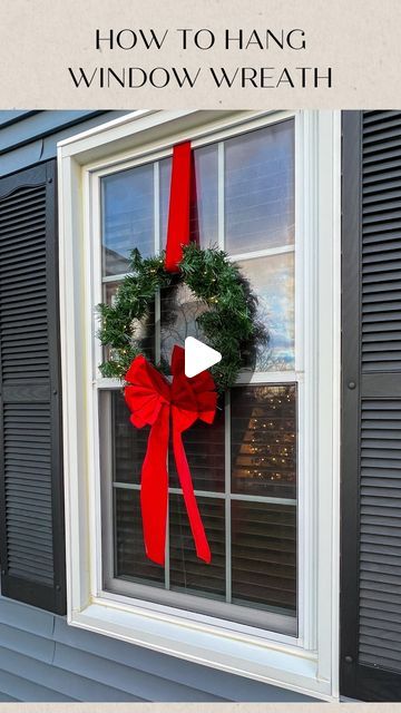 Jessica Cole on Instagram: "Here’s how we hung our lighted wreaths- no ladder required!! We have double sash windows, so we were able to hang these wreaths from the inside. Watch video for full tutorial. We used the fishing line to hold the wreaths in place so they didn’t swing or flip when the wind blew.   #christmas #wreaths #christmasdecor #christmasdecorations #christmashack #holidaydecor #christmaswreath #itsbeginningtolookalotlikechristmas #follow #insta #instagood #hack #christmashouse" Lighted Wreaths On Windows Outdoor, Wreath Hanging From Ribbon In Window, Green Wreath With Ribbon, Window Swag Ideas, Christmas Wreath On Fence, Christmas Wreaths For Outside Windows, Hang Christmas Wreaths On Windows, Christmas Wreath For Outdoor Windows, Wreath On House Exterior