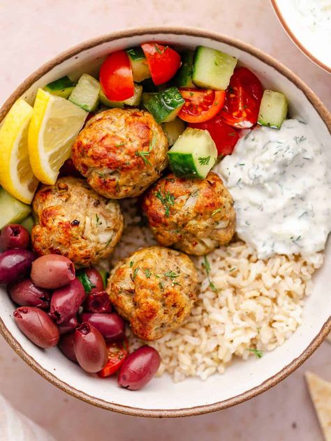 Enjoy the wholesome and satisfying Greek Turkey Rice Bowls, infused with vibrant Mediterranean flavors! Perfect for meal prepping, this recipe offers a week's worth of clean and nutritious eating, brimming with fresh ingredients. Turkey Greek Bowl, Meatball Bowls Healthy, Turkey Meatball Rice Bowl, Turkey Meatball Meals, Balanced Bowls Recipes, Meals For People With High Cholesterol, Greek Meatball Bowls Healthy, Mediterranean Turkey Recipes, Greek Turkey Bowls