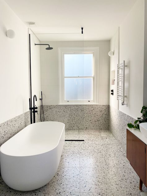 Real terrazzo bathroom with walk in shower and white freestanding bath Terrazo Bathroom Flooring, Terrazo Bathroom Floor, Terrazzo Architecture, Bathroom Terrazzo Floor, Grey Terrazzo Bathroom, Terrazzo Tiles Bathroom, Terrazzo Bathroom Floor, Natural Stone Tile Bathroom, Large Bathroom Design