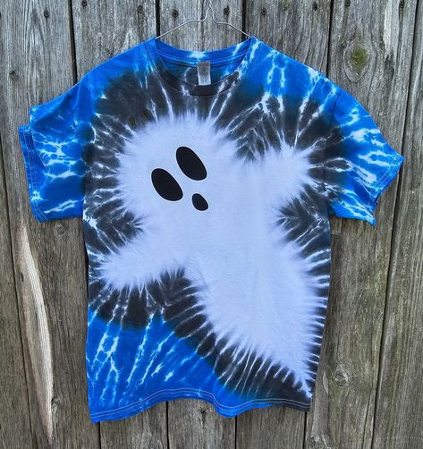 "Get ready for Spooky season and rock this shirt! Each shirt is unique in its own design since each shirt is hand dyed. The shirt above is similar to the shirt you will receive, but each shirt will have its own vibe of character.  The ghost face is only on the front unless you select \"add personalization\" during checkout selection and you can comment two options. Option 1: front: ghost face only on the front. Option 2: both: ghost face on the front and the back. If no selection is made, the ghost face will only be on the front of the shirt. It is not an additional charge if you would like both sides to have a ghost face. Handmade tie dye shirt made with permanent Procion fiber reactive dyes. Dyed on a 100% cotton Gildan T-shirt (if wanting a looser fit, recommended to order a size larger Halloween Tie Dye Patterns, Ghost Tie Dye, Halloween Tie Dye Shirts Diy, Halloween Diy Shirts, Bleach Tie Dye Halloween Shirts, Halloween Tye Dye Shirts, Halloween Tie Dye Shirts, Tie Dye Halloween Shirts, Tye Dye Halloween Shirts