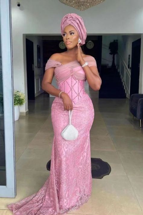 Who is ready to find out what the latest Aso Ebi styles 2023 for ladies look like? What colors and cuts are in trend for these stunning style? How to replicate these chic outfits for a special occasion? If you are, then follow my advice!!Visit our page for more styles. Lace Gown Styles Aso Ebi, Nigerian Traditional Dresses, Asoebi Lace Styles, Aso Ebi Lace Styles, Nigeria Wedding, Latest Aso Ebi Styles, Nigerian Lace Styles Dress, Nigerian Lace Styles, African Lace Styles