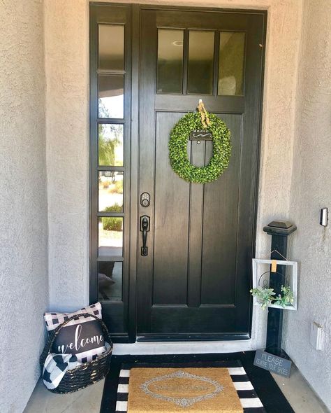 Natural light can be welcomed into an entryway with sidelights installed on one or both sides of a front door. This allows the door to have a limited number of glass panels or none at all. Accessorize a solid door with a simple wreath and layered door mats to make it more inviting. Black Front Doors With One Sidelight, Front Door With Left Sidelight, Single Side Light Front Door, Front Door With Right Sidelight, Side Doors Entrance Ideas, Front Door Single Sidelight, Front Doors With One Side Light, Front Door With One Side Panel, Single Front Door Ideas Entrance