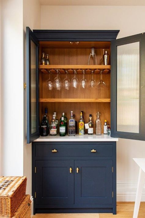 Read all about this project's bespoke kitchen cabinetry, including this breakfast larder with bifold doors and a bespoke drinks dresser featuring reeded glass cabinetry doors😍😍😍 Dining Room Dresser, Modern Kitchen Cupboards, Navy Cabinets, Herringbone Kitchen, Kitchen Bar Design, Home Bar Cabinet, Modern Home Bar, Cool Coffee, Open Plan Kitchen Living Room