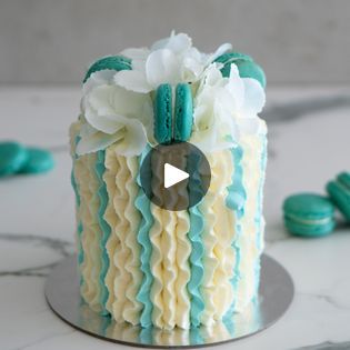 347K views · 7.3K reactions | Vertical Ruffle Cake Tutorial | Ruffles for the win this week! Created this little guy using the 104 piping tip and American Buttercream 

recipe for the buttercream I used in this... | By Rosie's Dessert Spot | Hey guys welcome to Dessert
Spot. In this video we are creating a really pretty
ruffled cake. You're going to need a four inch cake stuck to
a six inch cake board. Make sure you stick it on before you
fill otherwise cakes. Just going to go sliding around
everywhere. Press down firmly to secure it on your board. And
then continue building your cake. This is a buttercream
that I'm using for this particular tutorial. I like to
use half butter and half shortening for the American
buttercream. In it is vegetable shortening by the way. Create a
thin crumb co Ruffle Cake Tutorial, American Buttercream Recipe, Ruffled Cake, Vegetable Shortening, American Buttercream, Piping Tip, Ruffle Cake, Buttercream Recipe, Piping Tips