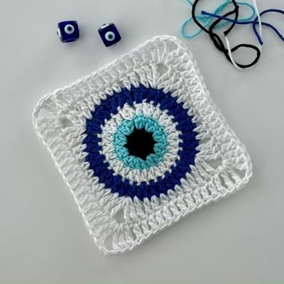 Free Crochet Patterns | 1000s Free To Download | LoveCrafts Crochet Evil Eye Granny Square, Evil Eye Granny Square Pattern, Evil Eye Crochet Pattern Free, Evil Eye Granny Square, Eye Granny Square, Crochet Dahlia, Evil Eye Crochet, Eye Crochet, Crochet Bracelet Pattern