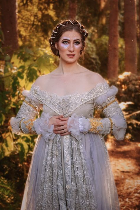 A white woman stands in the woods at golden hour. She has brown hair and is wearing an iridescent silvery embroidered off the shoulder Renaissance dress Just Breathe Dress, Ever After Just Breathe, Ever After Dresses, Ever After Danielle, Ever After Dress, Cinderella Collection, Cinderella Dress, Ren Fair, A Cinderella Story