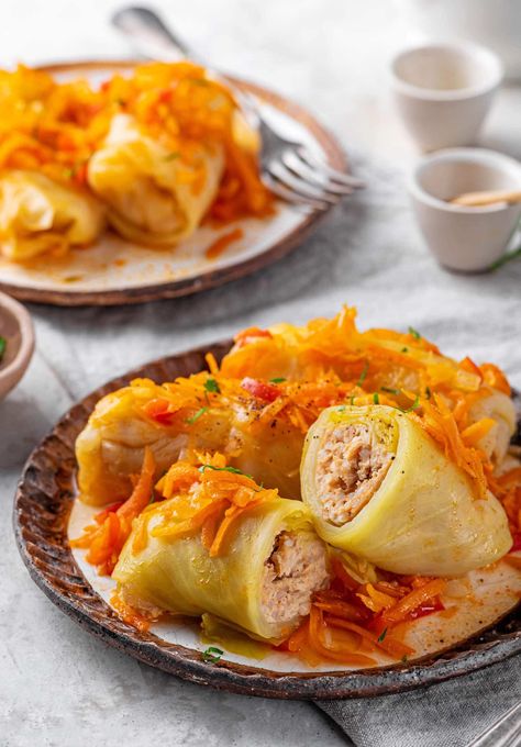 Easy Russian Chicken and Cabbage Rolls 🍂🍗

Try this Easy Golubtsi Recipe with Fresh Veggies! These Russian Cabbage Rolls are filled with tender chicken and packed with flavor. A Healthy Golubtsi that's both simple and satisfying.

✨ Save this Pin for a delicious and easy dinner!

#RussianCabbageRolls #EasyGolubtsiRecipe #ChickenCabbageRolls #GolubtsiWithVeggies #RussianChickenRolls #CabbageRollsRecipe #EasyChickenGolubtsi #HealthyGolubtsi #FreshVeggieCabbageRolls #SimpleRussianRolls Veggie Cabbage Rolls, Golubtsi Recipe, Rice Cabbage Rolls, Russian Chicken, Rice And Chicken, Cabbage Head, Savory Rice, Chicken And Cabbage, Cabbage Rolls Recipe