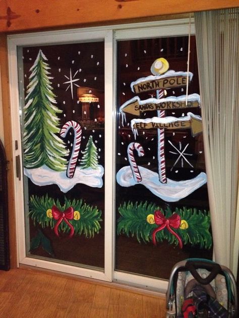 Cute Christmas Window Painting Ideas; Here are 20 easy Christmas window painting ideas to recreate on your windows this holiday season! Winter Tree Window Art, Christmas Window Classroom, Store Front Christmas Window Painting, Window Holiday Painting, Snowmen Window Painting, Christmas Storefront Window Painting, Painted Window Christmas, Winter Christmas Window Painting, Christmas Store Window Painting