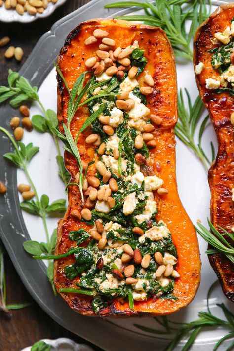 Stuffed Butternut Squash With Feta, Spinach Squash Recipes, Stuffed Squash Vegan, Smashed Butternut Squash Recipes, Stuffed Roasted Butternut Squash, November Seasonal Produce, Roasted Stuffed Butternut Squash, Stuffed Veggies Recipes, Vegetarian Stuffed Squash