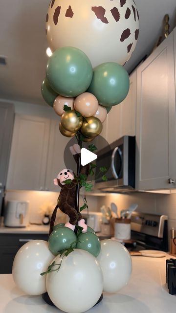 WreathSavvy by Staci on Instagram: "Make a safari themed balloon centerpiece w/ me!  Don’t ask me how I did it! 😜 @wreathsavvy 🎀 Nah but fr… I used the viral Walmart lamp stand as my base. #wreathsavvy #ballooncenterpieces #ballooncenterpiece #safaritheme #jungletheme #dontaskmehowididit #itwashard" Safari Party Centerpieces, Safari Theme Centerpieces, Jungle Centerpieces, Balloon Centerpieces Diy, Stick Centerpieces, Safari Centerpieces, Jungle Baby Shower Decorations, Balloon Baby Shower Centerpieces, Balloon Table Centerpieces