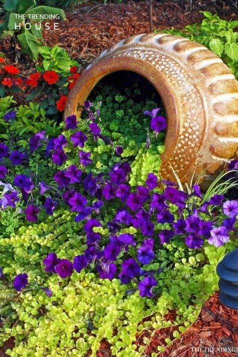 This list of spilled flower pot ideas is perfect for adding beauty to your lawn and garden! Simple and complex garden ideas for any yard! This list of spilling flower pots is a great way to add a truly unique landscape to your lawn or garden. #SpilledPotGarden #Flowers #Garden #Gardening #FlowerBed #Landscaping Creeping Jenny, Secret Gardens, The Secret Garden, Garden Containers, Lawn And Garden, Container Plants, Petunias, Dream Garden, Garden Planters