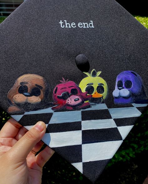 Five Nights at Freddys design 🩷 Only booking grad caps for June 18th and forward! Book through my website only 🩷www.advbellearts.com __________ #advbellecaps #gradszn #classof2024 #gradcapdesign #gradcapideas #fnaf Painted Graduation Cap Ideas, Twice Graduation Cap, Pitch Perfect Graduation Cap, Fnaf Grad Cap, Stardew Valley Graduation Cap, Fnaf Graduation Cap, Senior Grad Caps, Anime Graduation Cap, Senior Cap Ideas