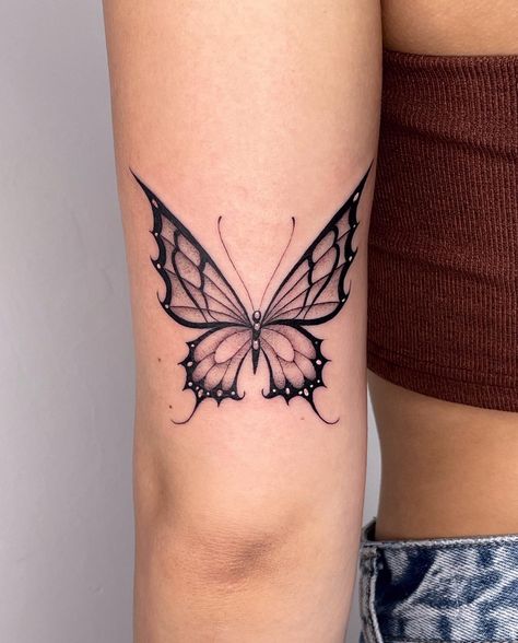 Butterfly Tattoo Styles, Pointy Butterfly Tattoo, Cool Butterfly Tattoos Unique, Grunge Butterfly Tattoo, Butterfly Throat Tattoos Women, Butterfly Tattoo For Women, Back Of Arm Butterfly Tattoo, Tattoo On Thigh For Women, Fire Butterfly Tattoo