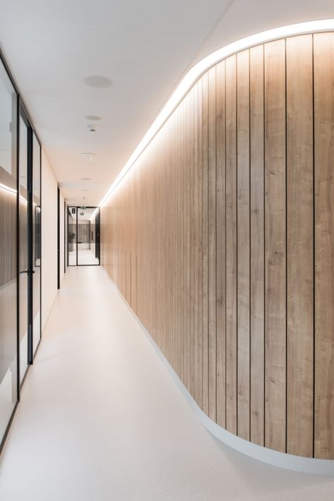 DENTLY Clinic - Healthcare Snapshots Container Community, Waiting Area Design, Healthcare Snapshots, Wooden Cladding, Day Room, Concrete Column, Corridor Lighting, Bratislava Slovakia, Wood Tile Floors