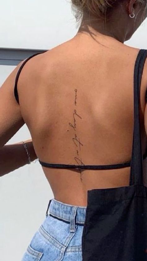 Back Tattoo Dainty Women, Back Word Tattoos Women Spine, Song Lyric Tattoos Spine, One Day At A Time Spine Tattoo, Unique Tattoos Spine, Godspeed Back Tattoo, Woman’s Tatoos, Fine Line Script Spine Tattoo, Short Quotes Tattoos For Women