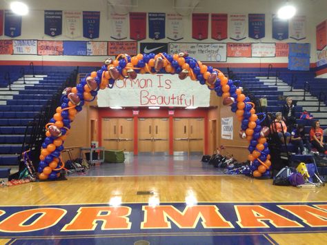 Homecoming Assembly balloon arch in gym, Bishop Gorman Catholic High School Homecoming Decorations, Cheer Banquet, Balloon Arch Decorations, Balloon Gifts, Trunk Party, Nerf Birthday Party, Balloon Company, Orange Balloons, Grad Party Decorations