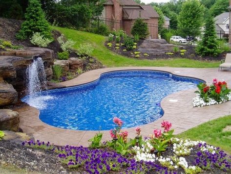 Love the color, stone accents and stamped concrete surrounding this pool. | homechanneltv.blo... #coolpools Pool Liners, Swimming Pools Inground, Pool Waterfall, Pool Garden, Luxury Pools, Backyard Pool Landscaping, Small Pools, Dream Pools, Beautiful Pools