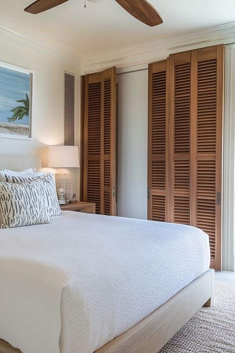 Keep your bedroom feeling light and airy with louvered closet doors. Perfect for adding texture and a tropical vibe to your space. 🌴✨ #LouveredDoors #TropicalVibes #BedroomStyle #ElevatedCloset Beachy Closet Doors, Tropical Closet, Beachy Closet, Louvered Closet Doors, Beach Room, Closet Designs, Closet Doors, Closet Design, Tropical Vibes