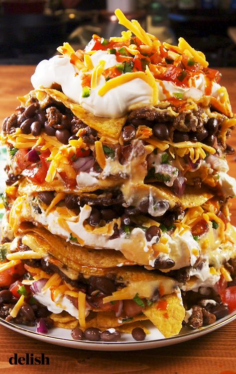 If you've never made "Trash Can Nachos" you're SERIOUSLY missing out. Get the recipe at Delish.com. #recipe #easy #easyrecipe #delish #nachos #chips #beans #mexican #apps #appetizers #gameday #football #superbowl #cheese #sourcream #cholula #hotsauce Trash Can Nachos Recipe, Trash Can Nachos, Can Nachos, Nachos Recipe, Football Food, Game Day Food, Mexican Dishes, Fajitas, Appetizers Easy